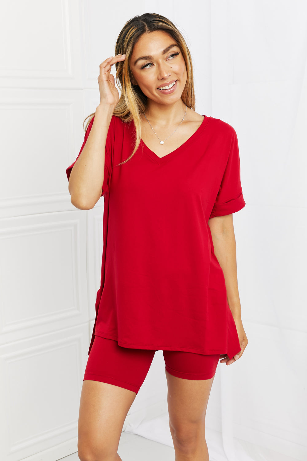 Model right facing view wearing burgundy two piece lounge short set.